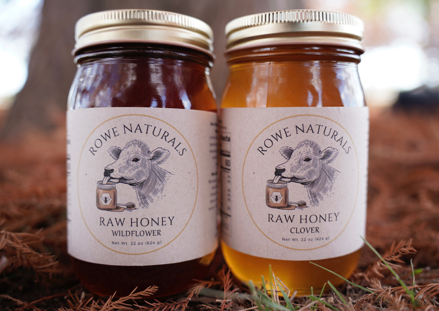 Two jars of Rowe Naturals raw honey on a natural background